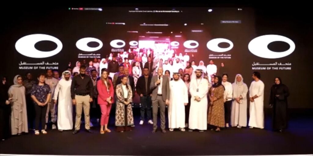 Several people on stage at the Museum of the Future